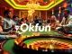 Playing cards and poker chips showcased at a vibrant casino table, representing Okfun's engaging gambling experience.