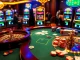 Players enjoying an exciting game of roulette at mint88 casino, surrounded by vibrant slot machines and poker chips.